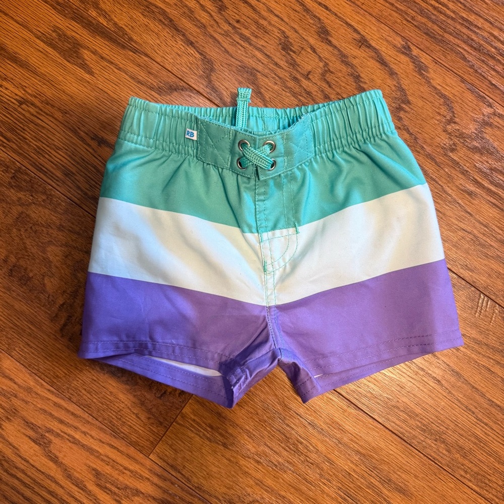 Ruggedbutts green purple color block baby swim trunks